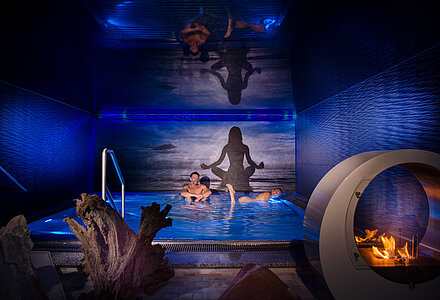Hotel guests in the indoor saltwater pool at the Kuschelhotel Winzer on Lake Attersee