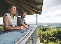 A couple enjoys the view from a viewing tower in the Attersee-Attergau region