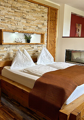 A cosy bed in the Kuscheltraum Superior Junior Suite