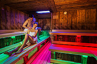 A couple in the cabin sauna at the Edelstein Spa at the Hotel Winzer