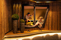 A couple relaxing in the relaxation room at the Emotion Spa in the Hotel Winzer